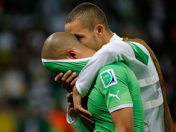 algeria-s-feghouli-is-consoled-by-teammate-mesbah-after-their-loss-to-germany-at-the-end-of-their-2014-world-cup-round-of-16-game-at-the-beira-rio-stadium-in-porto-alegre_4946249